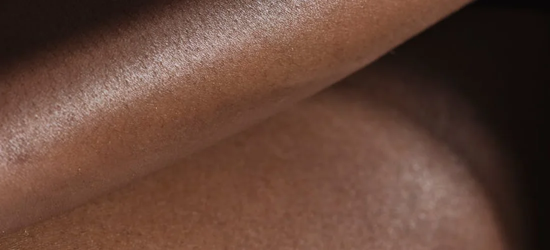 Close-up view of human skin texture, showing natural tone and fine details.