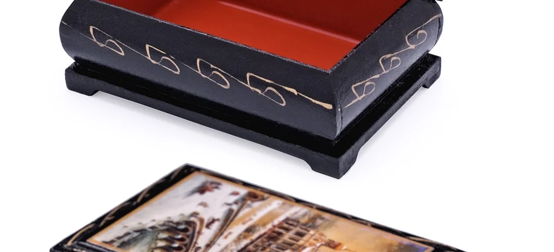 Open casket interior with red lining beside a display item suggesting mixed open and closed casket elements.