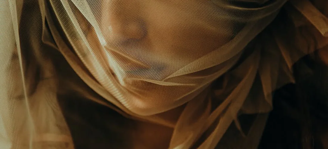 Close-up of flowing, translucent burial shroud fabric